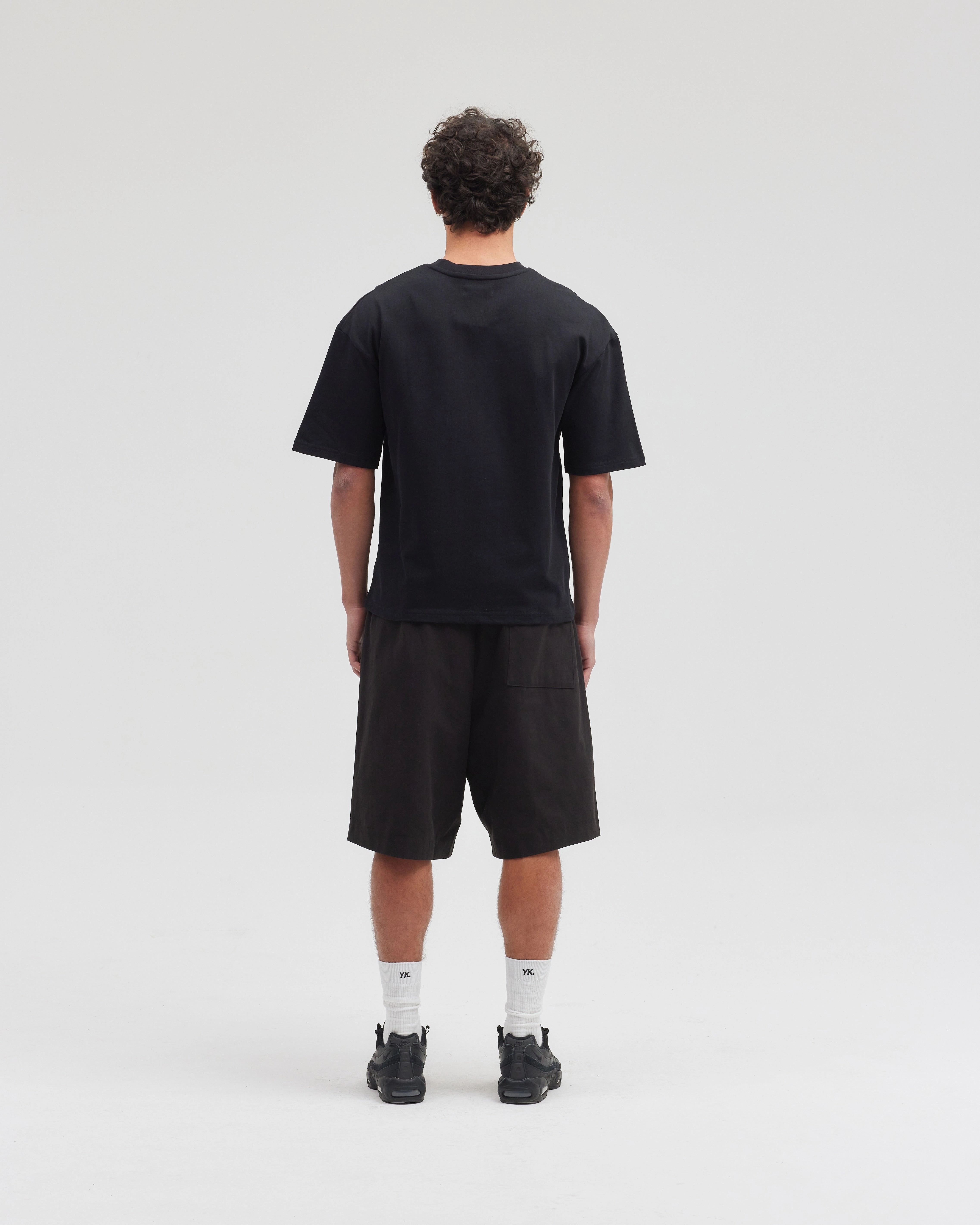 LONGLINE SHORTS | Black Sandals